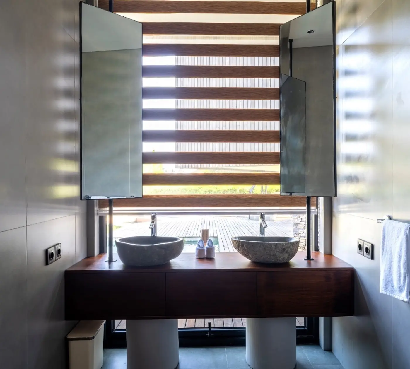 Twin stone basins and timber vanity in the Meditation House bathroom