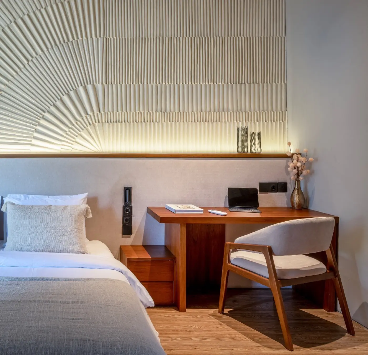 Bedroom with timber desk and slatted screen at Meditation House