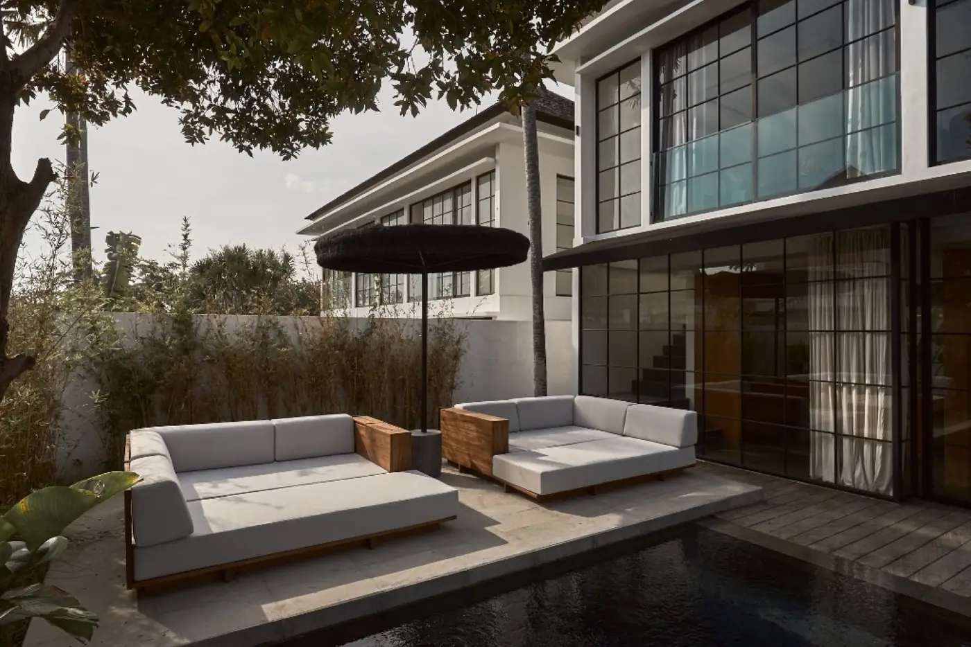 Poolside lounge and outdoor sofa at the Umalas villas