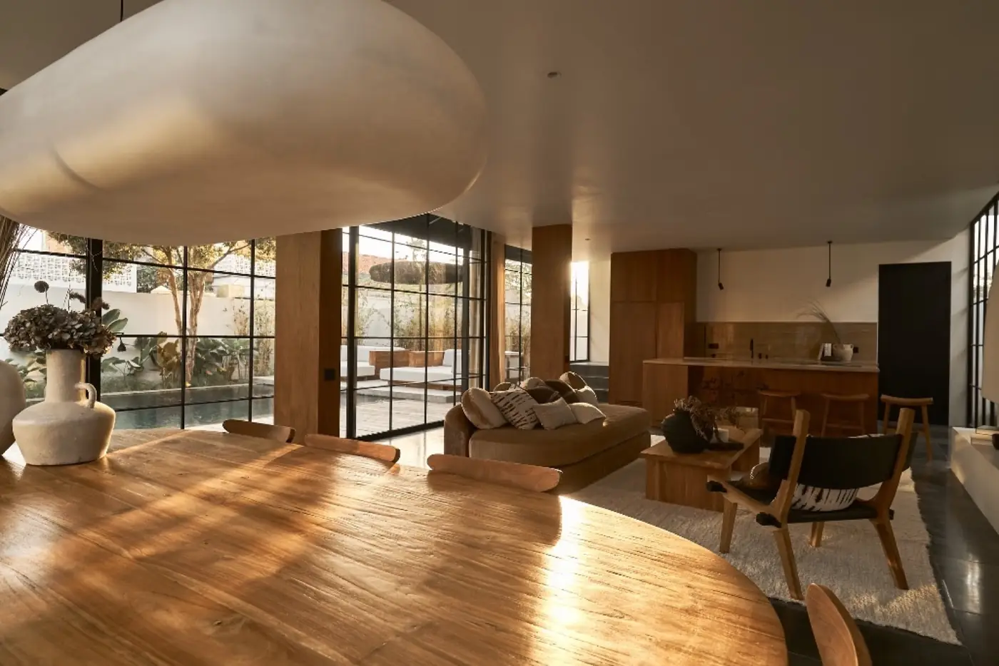 Open-plan living space with timber floor in an Umalas villa