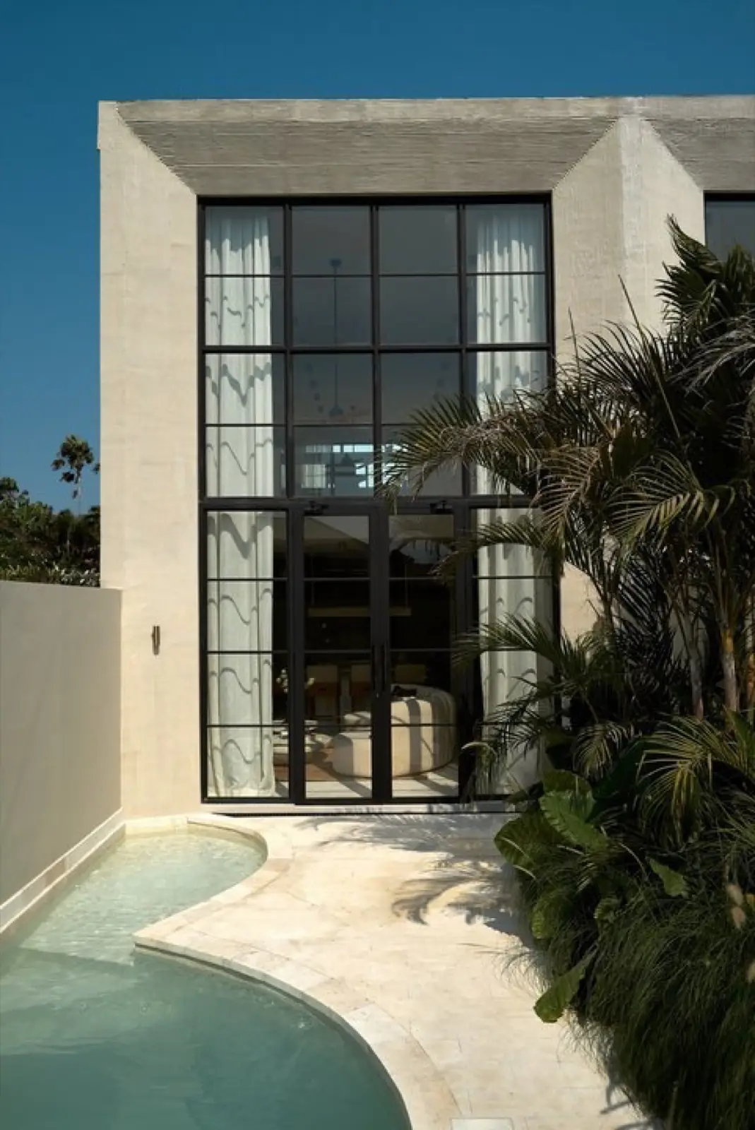 Full-height steel-framed glazing on a Vesna townhouse facade